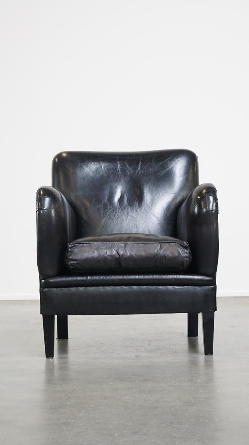 Fauteuil en cuir de mouton de couleur noire