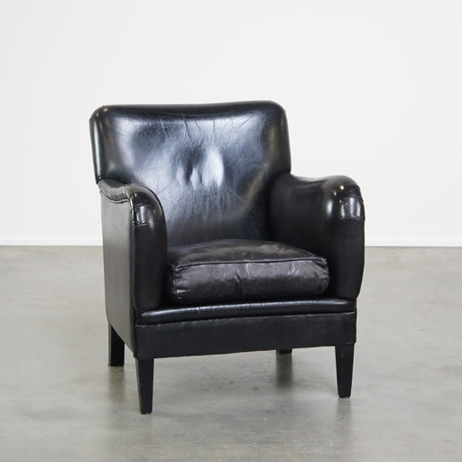 Fauteuil en cuir de mouton de couleur noire