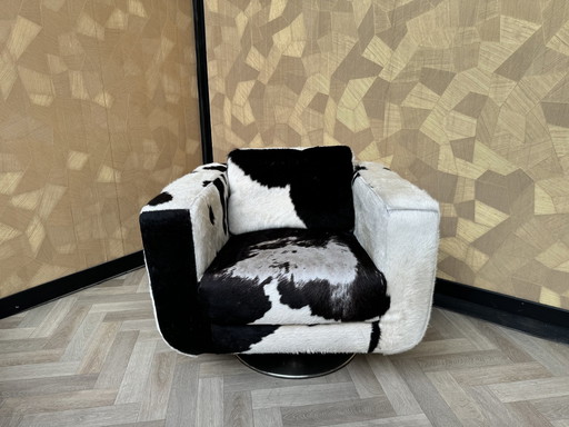 Fauteuil pivotant en cuir de vache