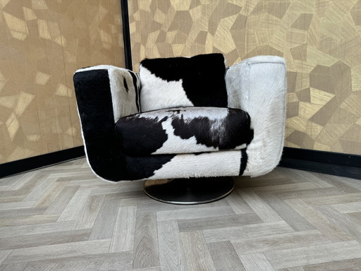 Fauteuil pivotant en cuir de vache