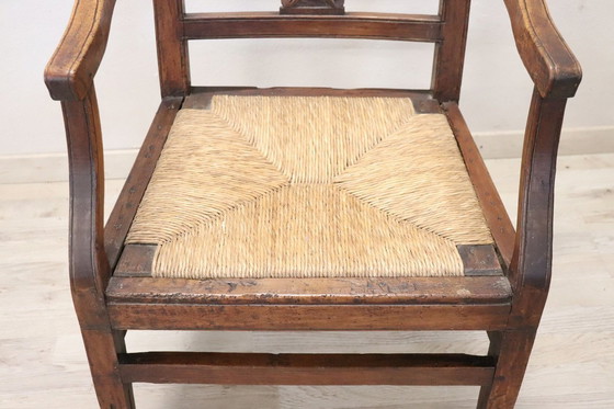 Image 1 of Fauteuil rustique ancien en bois avec assise en paille