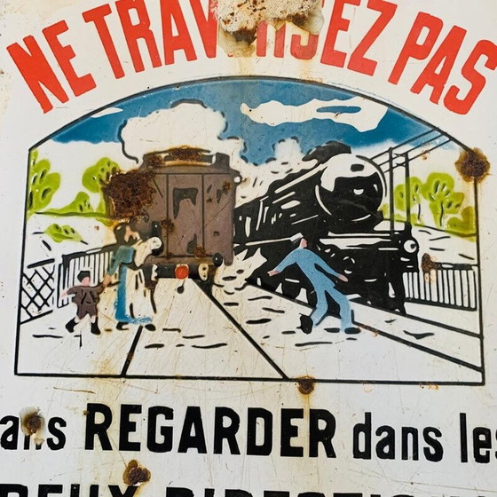 Image 1 of Vintage enamel sign "Don't cross a train may hide another", 1930