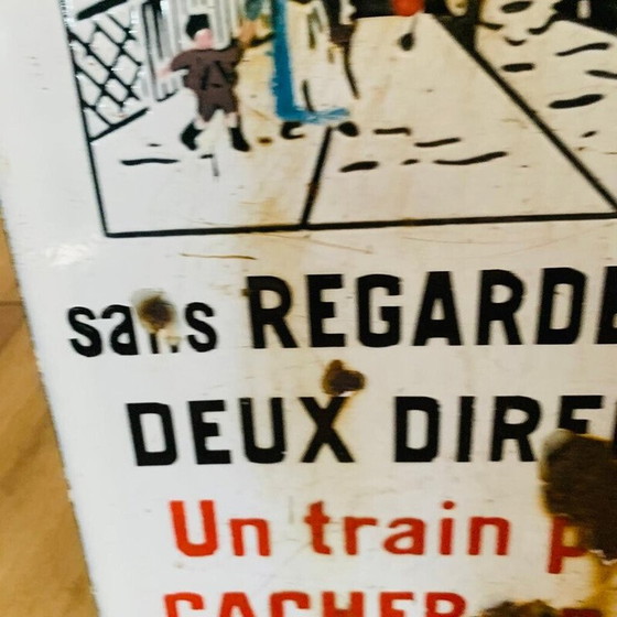 Image 1 of Vintage enamel sign "Don't cross a train may hide another", 1930