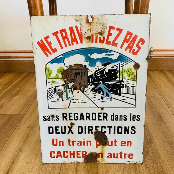 Image 1 of Vintage enamel sign "Don't cross a train may hide another", 1930