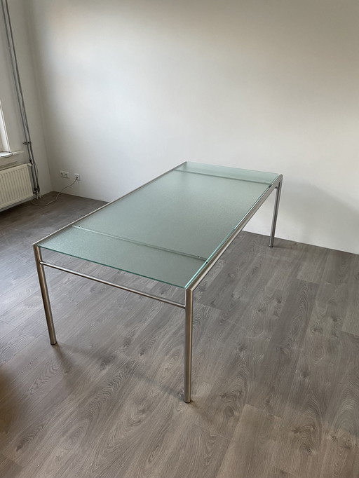 Table de salle à manger en verre et acier inoxydable