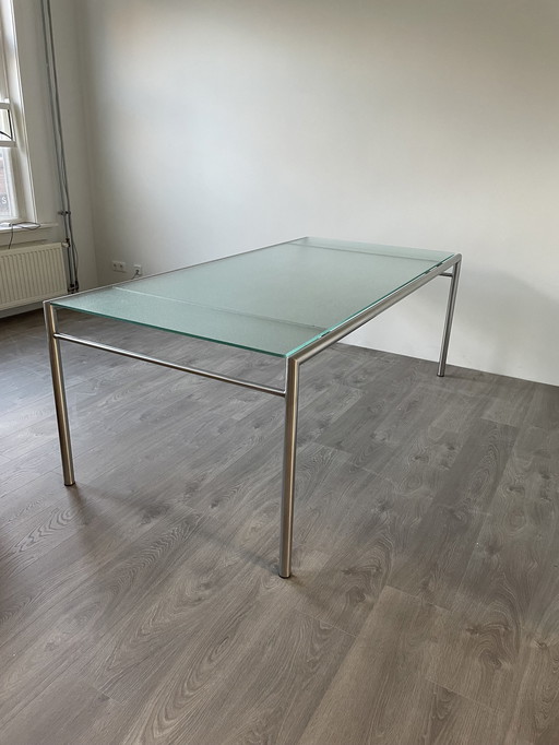 Table de salle à manger en verre et acier inoxydable