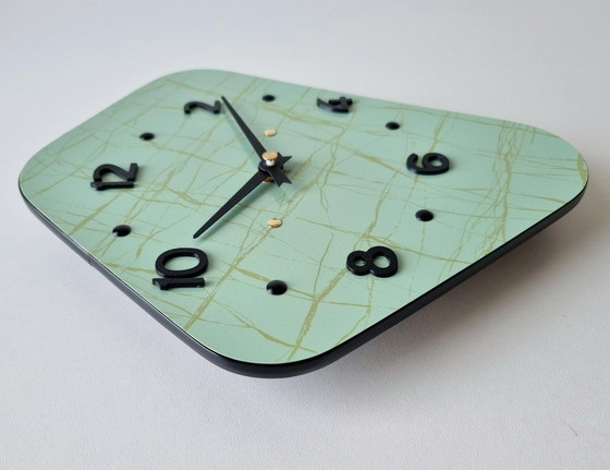 Image 1 of Horloge Vintage • Cerf-Volant • Odo • Space Age • 1950