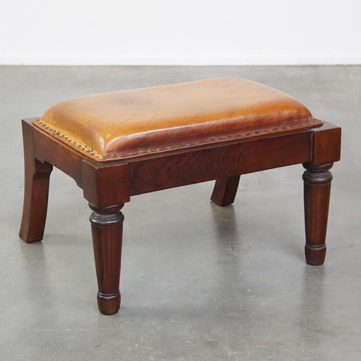 Hocker en cuir de mouton combiné avec du bois