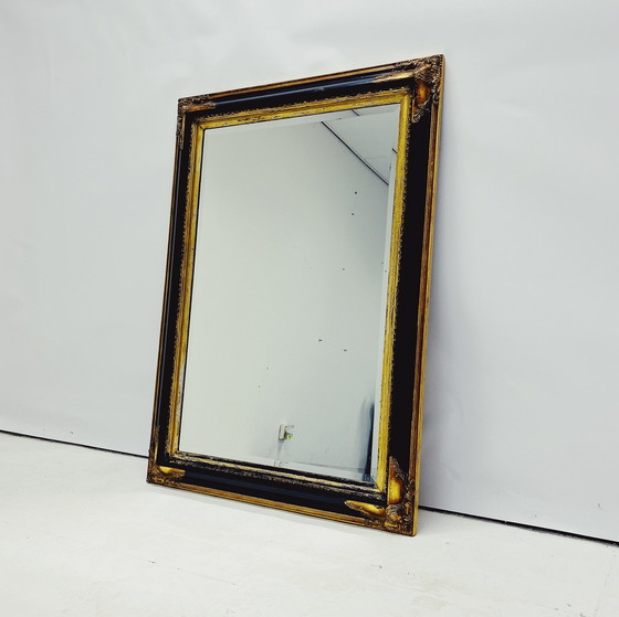 Image 1 of Miroir baroque avec cadre en bois décoratif.