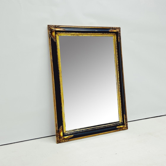 Image 1 of Miroir baroque avec cadre en bois décoratif.