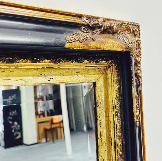 Image 1 of Miroir baroque avec cadre en bois décoratif.