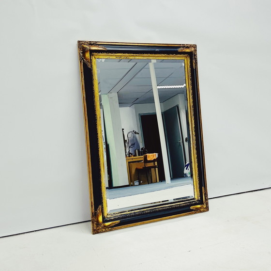 Image 1 of Miroir baroque avec cadre en bois décoratif.