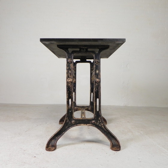 Image 1 of Table industrielle, table de jardin avec plateau en pierre sur cadre en fonte, années 1930