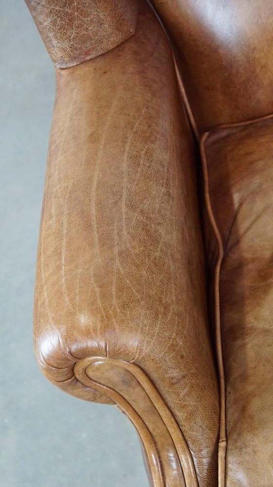 Image 1 of Fauteuil à oreilles en cuir de boeuf