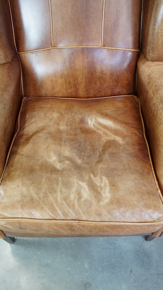 Image 1 of Fauteuil à oreilles en cuir de boeuf