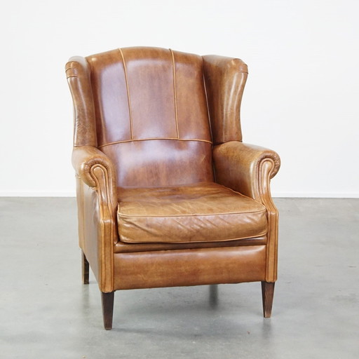 Fauteuil à oreilles en cuir de boeuf