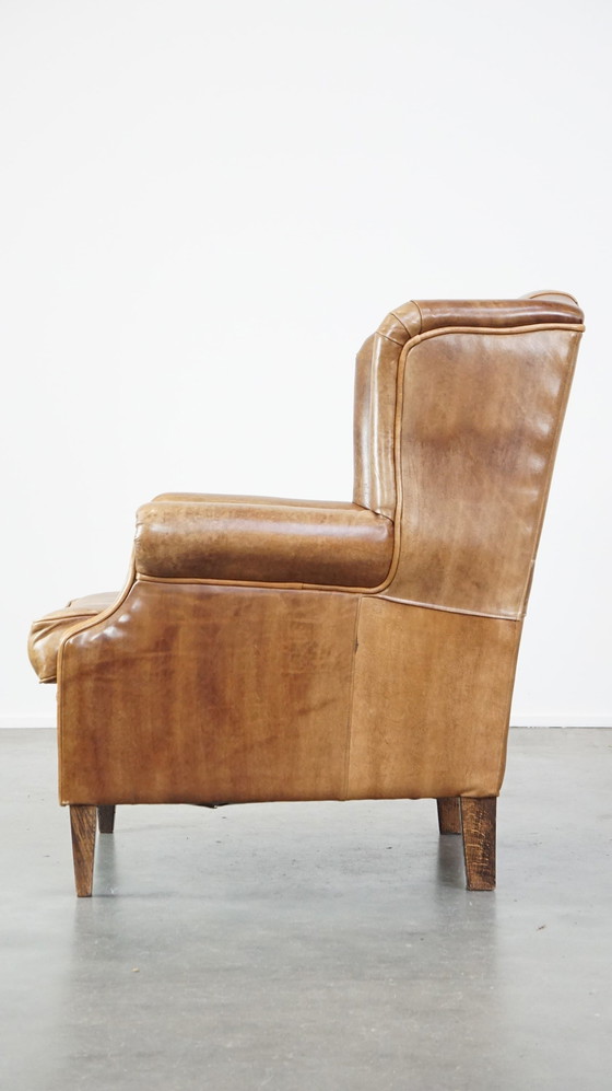 Image 1 of Fauteuil à oreilles en cuir de boeuf