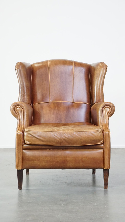 Fauteuil à oreilles en cuir de boeuf