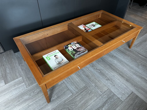 Table basse avec plateau en verre et tiroirs