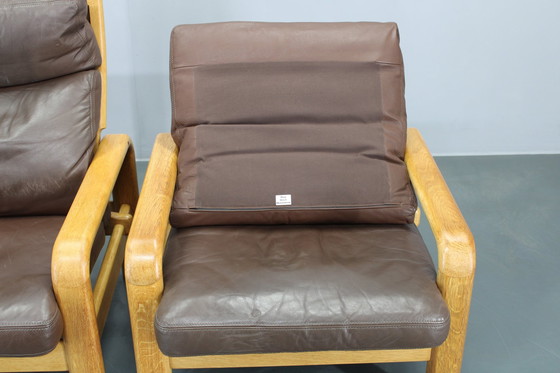 Image 1 of 1970 L. Olsen & Søn Paire de fauteuils en chêne et cuir, Danemark