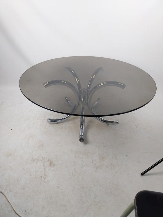 Image 1 of 1 X Table basse en acier chromé avec plateau en verre fumé 110Cm.