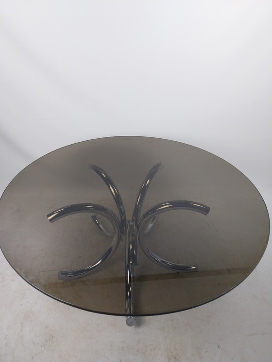 Image 1 of 1 X Table basse en acier chromé avec plateau en verre fumé 110Cm.