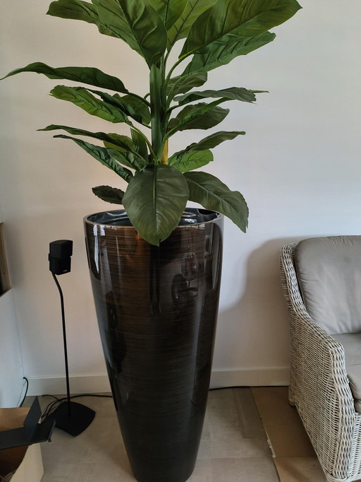 Vase vintage avec plante artificielle