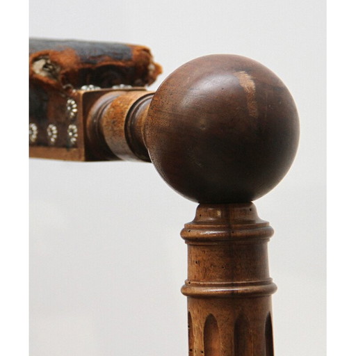 Paire de fauteuils vintage en noyer et cuir