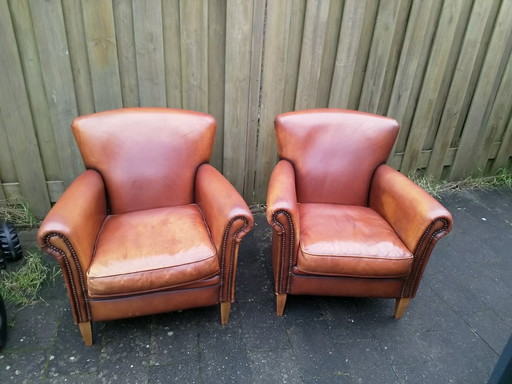 2X fauteuils Club en peau de mouton Muylaert