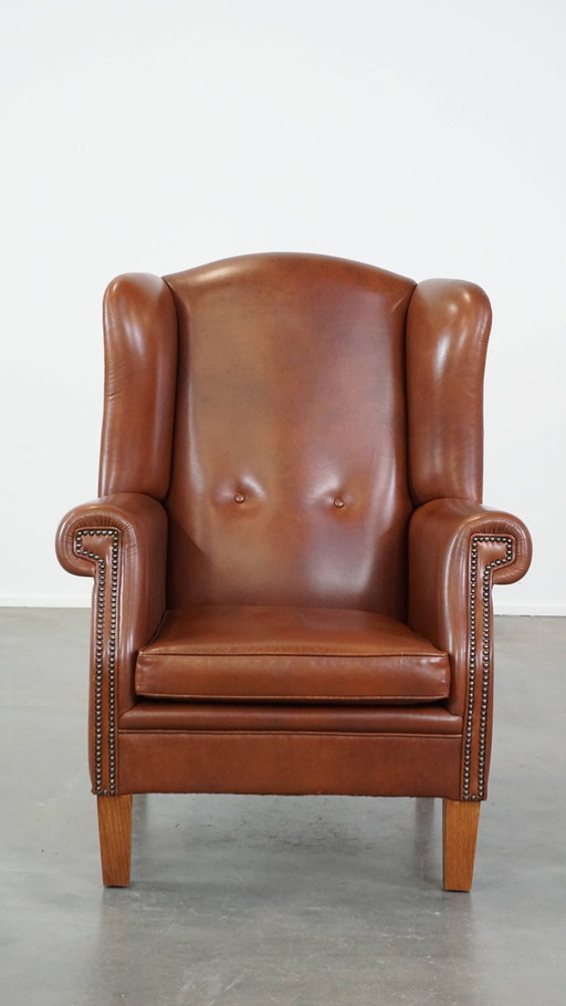 Fauteuil à oreilles en cuir de bœuf