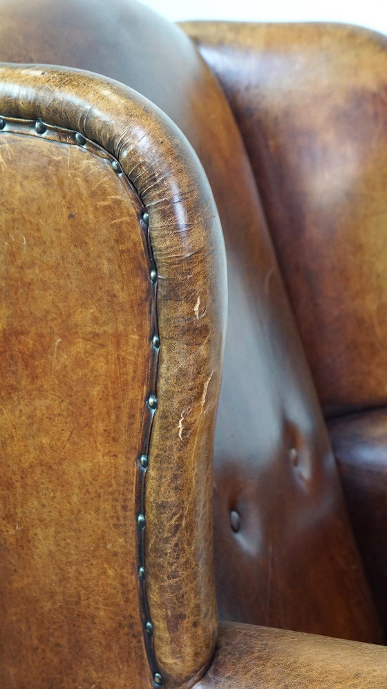 Image 1 of Grand fauteuil à oreilles en cuir de mouton