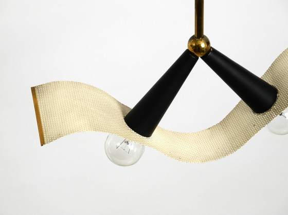Image 1 of Original Mid Century Brass Ceiling Cone Lamp With A Curved Perforated Sheet Lampshade