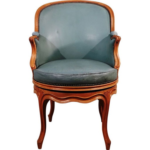 Fauteuil pivotant en cuir vintage
