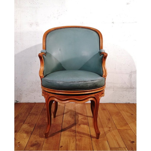 Fauteuil pivotant en cuir vintage
