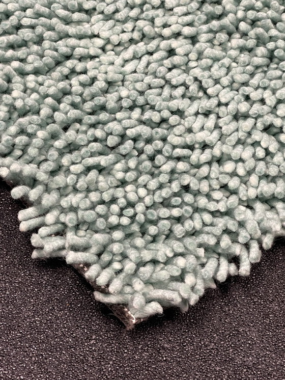 Image 1 of Brink & Campman sur un tapis vert clair