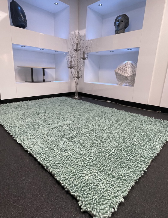 Image 1 of Brink & Campman sur un tapis vert clair