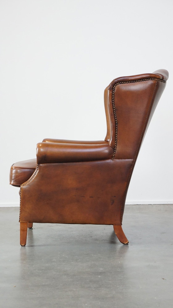 Image 1 of Fauteuil à oreilles en cuir de boeuf