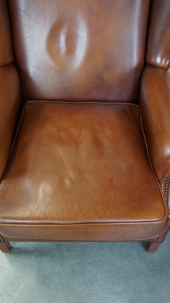 Image 1 of Fauteuil à oreilles en cuir de boeuf