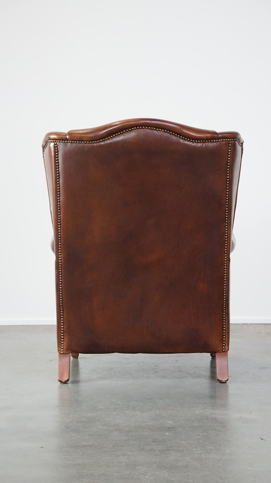 Image 1 of Fauteuil à oreilles en cuir de boeuf