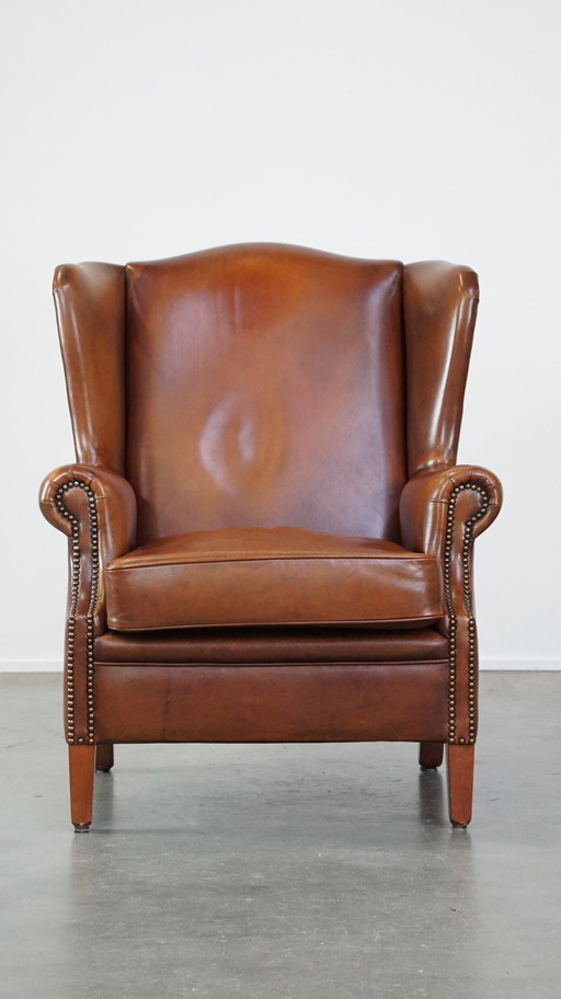 Fauteuil à oreilles en cuir de boeuf