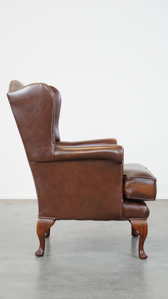 Image 1 of Fauteuil à oreilles en cuir de bœuf