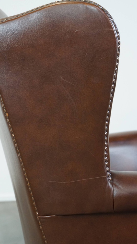 Image 1 of Fauteuil à oreilles en cuir de bœuf