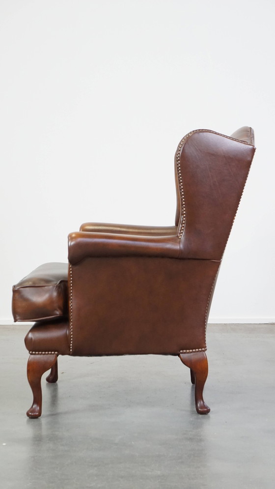 Image 1 of Fauteuil à oreilles en cuir de bœuf