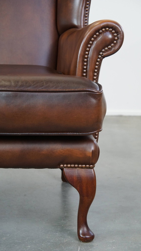 Image 1 of Fauteuil à oreilles en cuir de bœuf