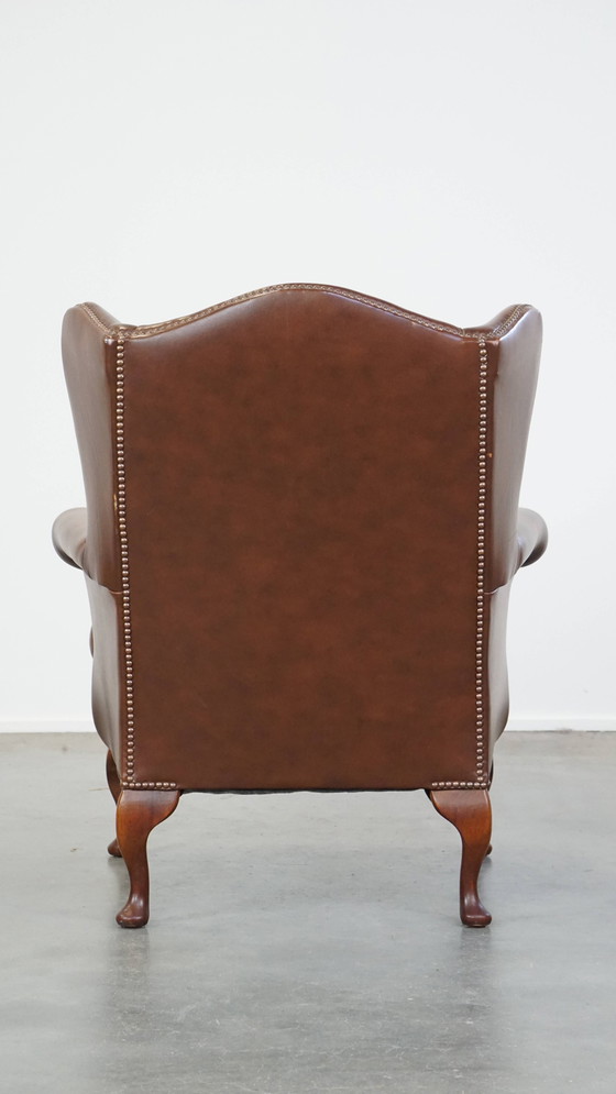 Image 1 of Fauteuil à oreilles en cuir de bœuf