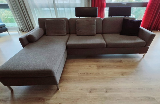 Image 1 of Brühl Schlafsofa mit Chaise Longue, Lederhocker, Kopfstützen und Kissen.