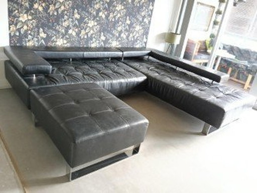 Ecksofa aus Leder und Hocker Montel Cipriani