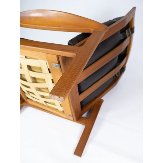 Image 1 of Vintage-Sessel mit Hocker aus Teakholz, bezogen mit schwarzem Leder von Arne Vodder für Komfort, 1960