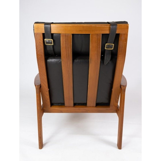 Image 1 of Vintage-Sessel mit Hocker aus Teakholz, bezogen mit schwarzem Leder von Arne Vodder für Komfort, 1960