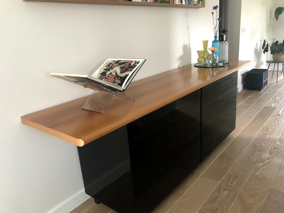 Image 1 of Design Sideboard Schwarz Hochglanz mit schräger Kirschholzplatte